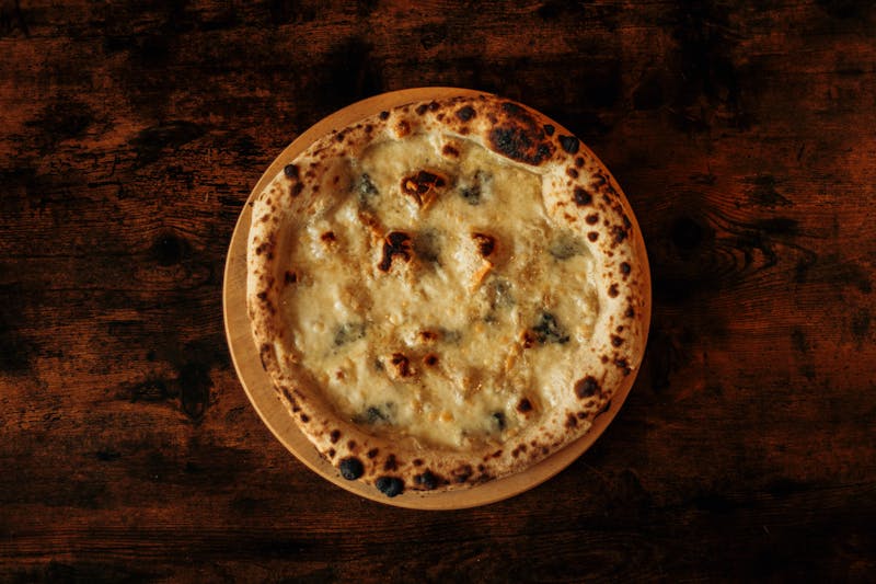 Four cheese pizza with mozzarella gorgonzola parmesan and ricotta
