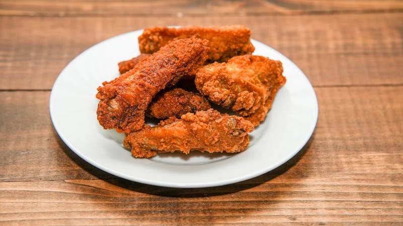 Crispy buffalo wings with blue cheese dipping sauce