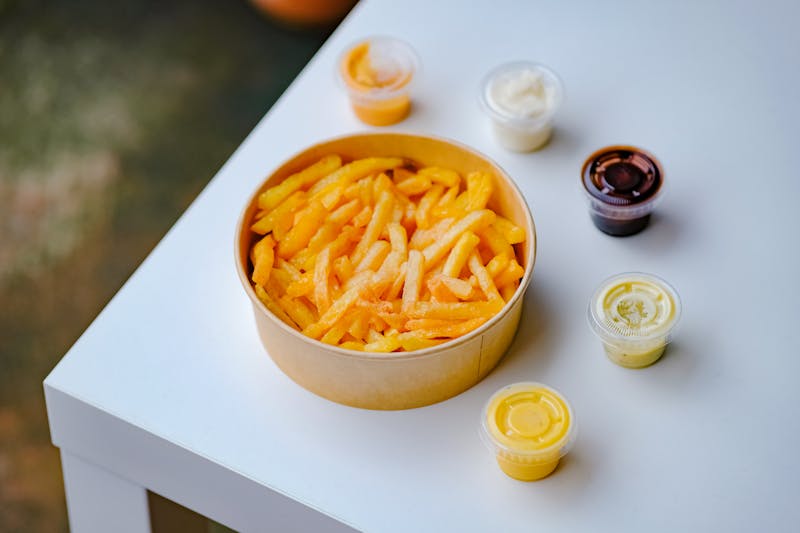 Crispy seasoned fries with dipping sauce
