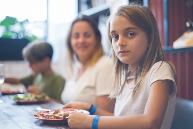 Families enjoying weekend brunch event at Jet's pizza Queens